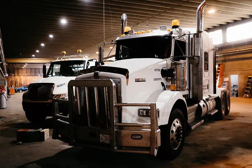 Diesel mechanic performing commercial fleet repairs on semi truck in Edmonton, AB