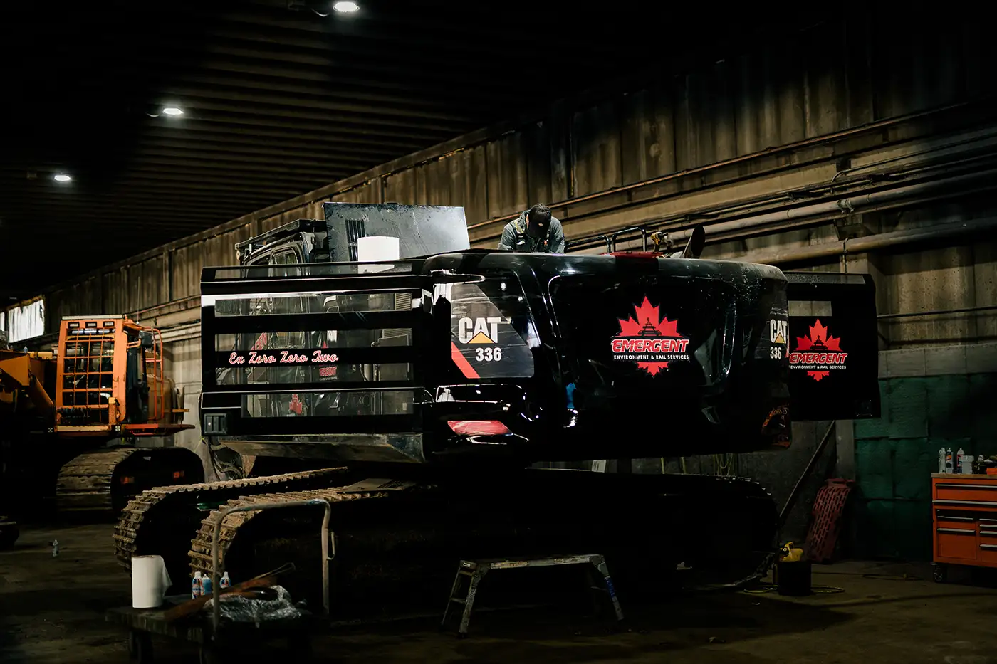 Diesel mechanic performing heavy equipment repairs in Edmonton, Alberta