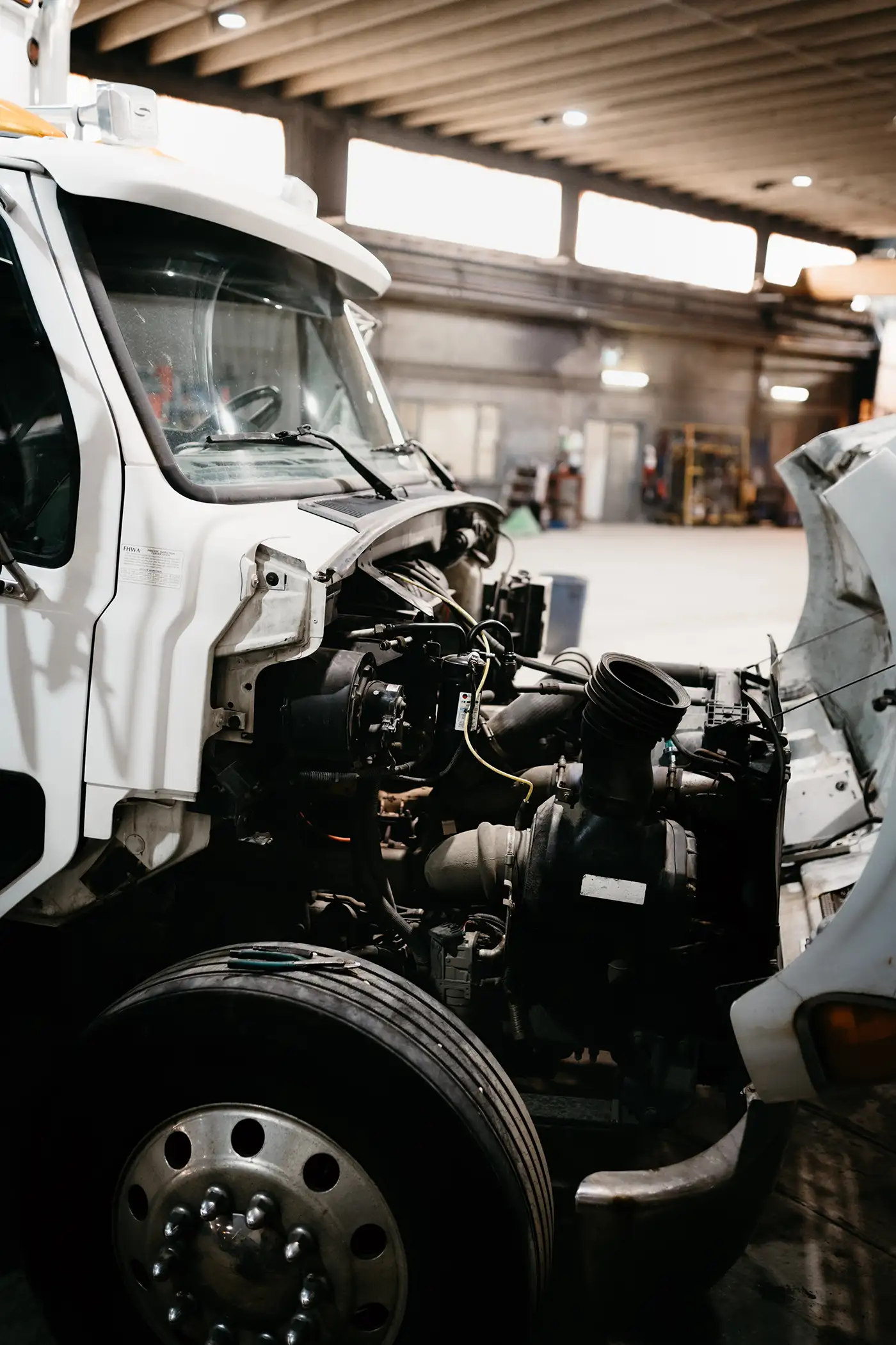Diesel mechanic performing heavy-duty truck repairs in Edmonton, Alberta