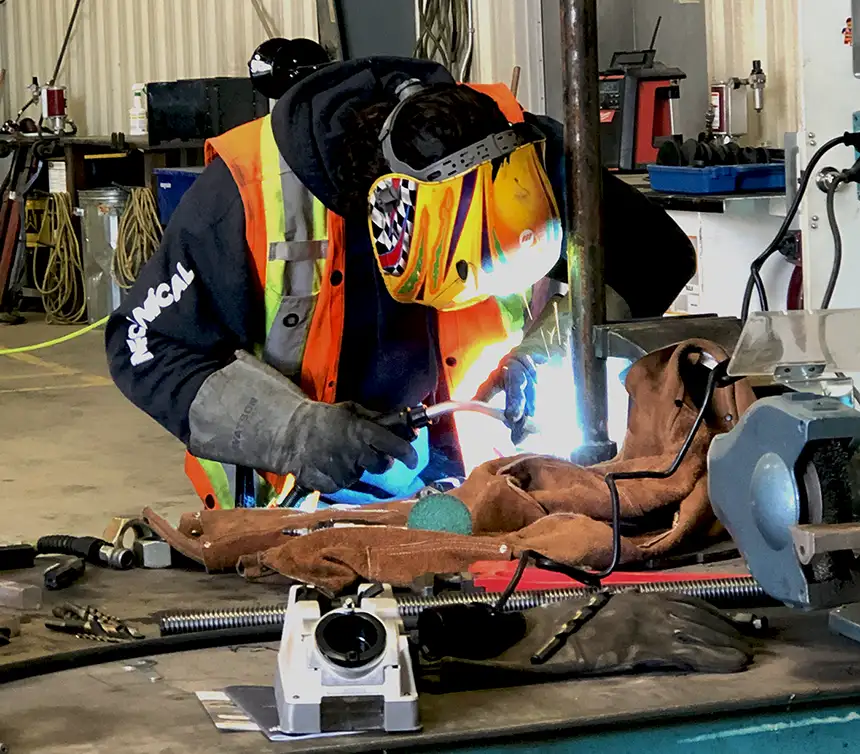 Diesel mechanic performing welding services in Edmonton, AB