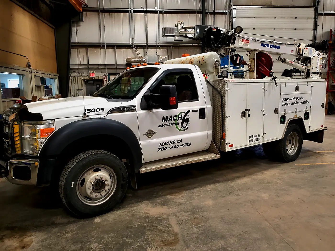 Mobile mechanic performing mobile truck repairs onsite in Edmonton, Alberta