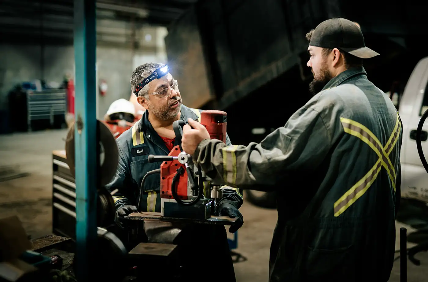 Diesel mechanic performing propane system inspection in Edmonton, Alberta